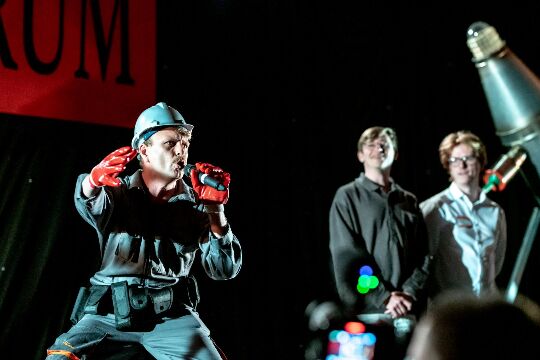 A man wearing a red hat with a microphone
